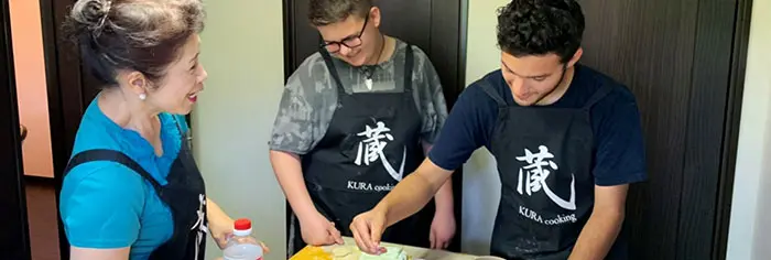 Foreign tourists enjoying cooking
